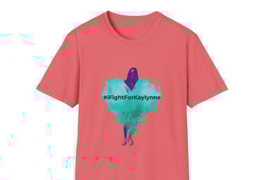 a coral colored graphic tee shirt with a teal heart and a shadow of a girl