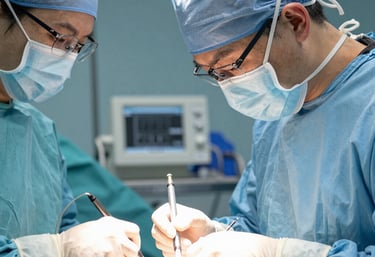Close-up of a patient’s hand being carefully wrapped with a supportive bandage.