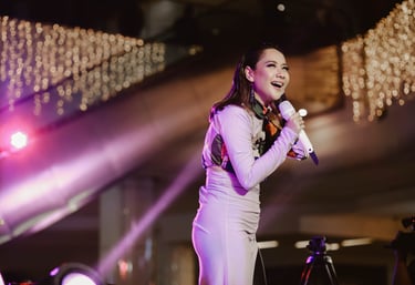 Bunga Citra Lestari, BCL, a woman in a white dress and a microphone
