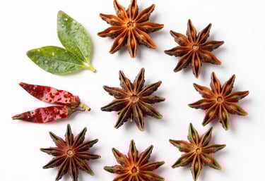 Close-up of colorful organic spices neatly arranged in wooden bowls.