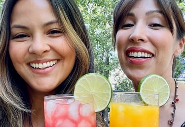 two women holding agua Frescas in orange county