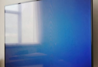 A close-up of a vibrant Smart TV screen showing deep blue and off-white colors, highlighting the clear resolution after professional repair.