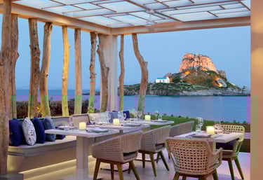 Ouzo outdoor restaurant over looking the sea at Ikos Aria  