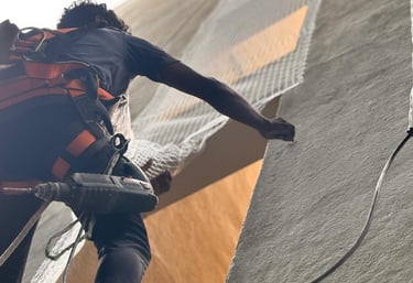 Technician carefully installing a ventilation duct in a modern building.