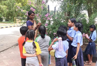 Teacher conducting an English phonics class for children at Little Cubs Learning Academy in Tiruvann