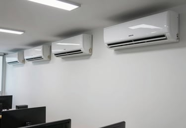 A wide photography shot of a modern Brazilian commercial office with multiple wall-mounted AC units, showing a professional and cool work environment, bright lighting.