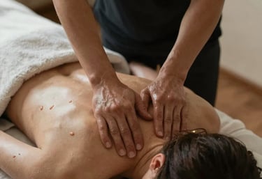 Professional massage therapist performing a Swedish back massage for a woman at Zen Massage Therapy