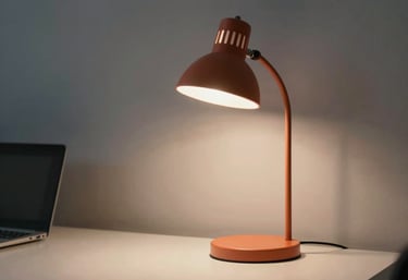A minimalist North American office space at night, one desk lamp glowing with terracotta light, cinematic atmosphere.