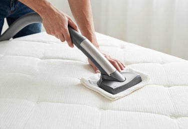 Close-up of a technician using specialized equipment to clean a car seat upholstery.