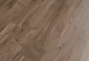 A craftsman installing floating parquet flooring in a bright living room.