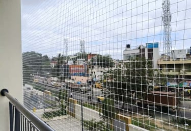 Close-up of a neatly installed pigeon net on a residential balcony in Hongasandra.
