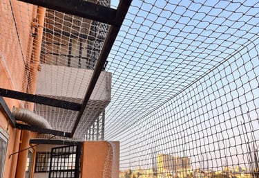 A clean, well-installed balcony safety net protecting a family’s home.