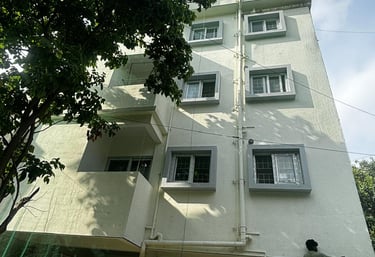 Close-up of a sturdy safety net installed on an apartment balcony in Pune.