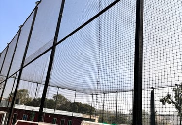 Close-up of a sturdy balcony safety net installed on a high-rise apartment in Chennai.