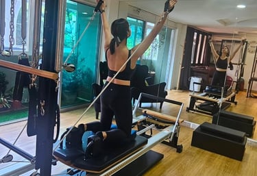 Izzie practicing on the reformer at The Pilates Room Bangsar