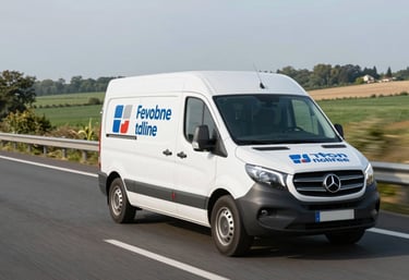 A branded professional service van driving on a modern highway through the French countryside, representing national coverage and mobility.