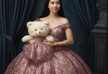 a woman in a pink dress holding a teddy bear