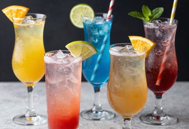 Close-up of beautifully arranged cocktail glasses with a minimalist black and gold theme.