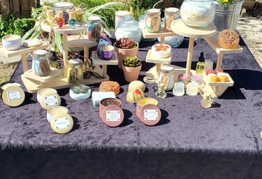 Handmade Organic Beeswax candles, artisan soaps, and oil diffusers on display