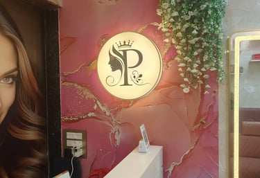 Reception area and salon logo at Pooja's Luxury Salon in Mira Road East