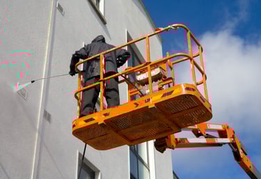 cleaning and pressure washing on a lift in fort myers