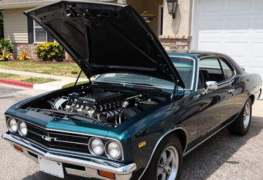 Close-up of a high-performance LS engine with custom tuning components in a workshop setting.