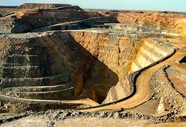 a large open pit hole in a large open pit