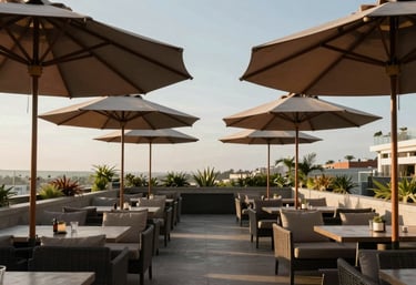 An elegant South American hotel rooftop lounge featuring multiple matching ombrelones in a symmetrical composition during the afternoon.