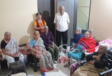 Seniors watching television in an Old Age Home in Pune