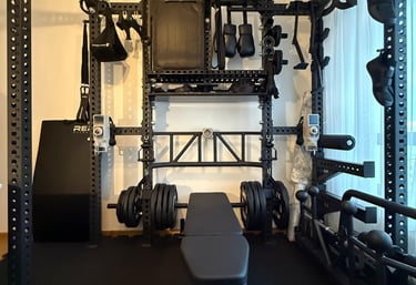 a homegym with a gym equipment set up- Mind Muscle Perfection 