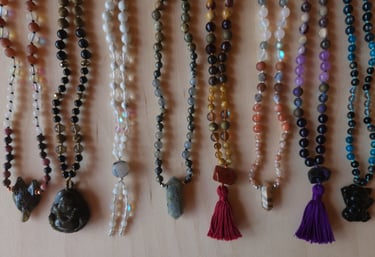 Hand-knotted gemstone mala necklace with 108 beads, created by Tina Marie Medina for spiritual meditation and energy healing