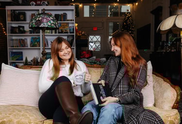Kandelyne and Katie sitting on the couch together