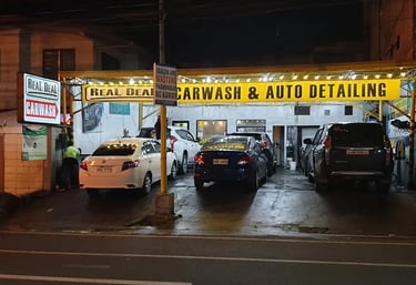 a car wash station with cars parked in front of it