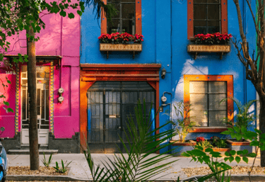 Colorful buildings in Mexico – vibrant local culture near top fertility clinics.