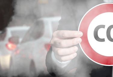 a man in a suit holding a sign that says co2