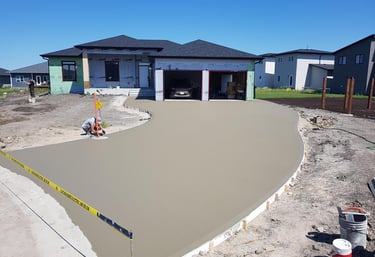 finishing touches on a driveway before brooming