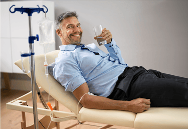 Specialized physician applying IV therapy with essential vitamins to strengthen the body, enhance th