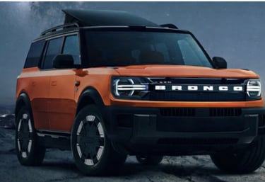 ford bronco suv laranja sem placa frontal em terreno rochoso à noite