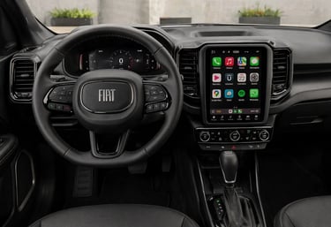 Interior da Fiat Toro Ultra 2026 com volante multifuncional e central multimídia vertical