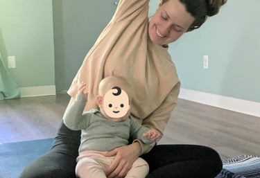 A mother and her infant stretching together