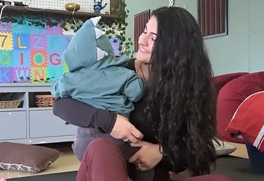 a mother and her child doing yoga together.