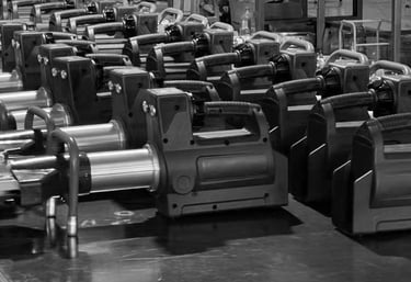 Rescue and breaching tools staged for assembly inside the factory workshop