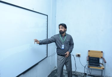 a man standing in front of a white board board