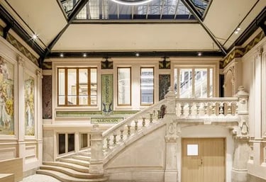 a large room with a staircase leading to a staircase