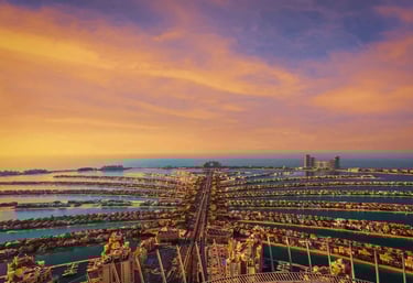 Aerial view of Palm Jumeirah featuring luxury villas and private beachfront residences, representing exclusive real estate in