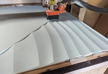 a machine is cutting material with a router bit