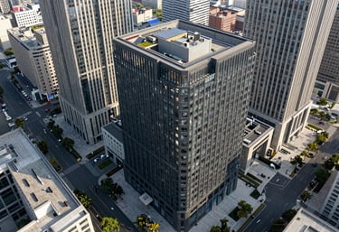 An aerial drone perspective of a well-organized city business district featuring modern charcoal and stone facades.
