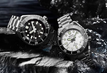 two watches on a rock wall in a river