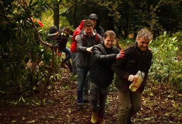 a team walking in the forest with Dorchess and Awe Academy