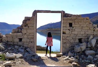 Young traveller exploring stone ruins in Alassa village